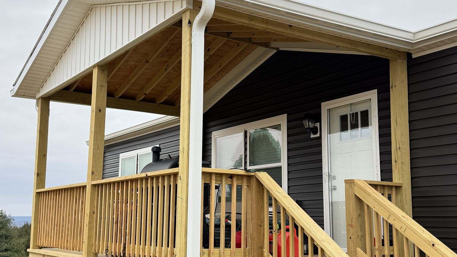 New seamless white gutters installed on a Virginia home