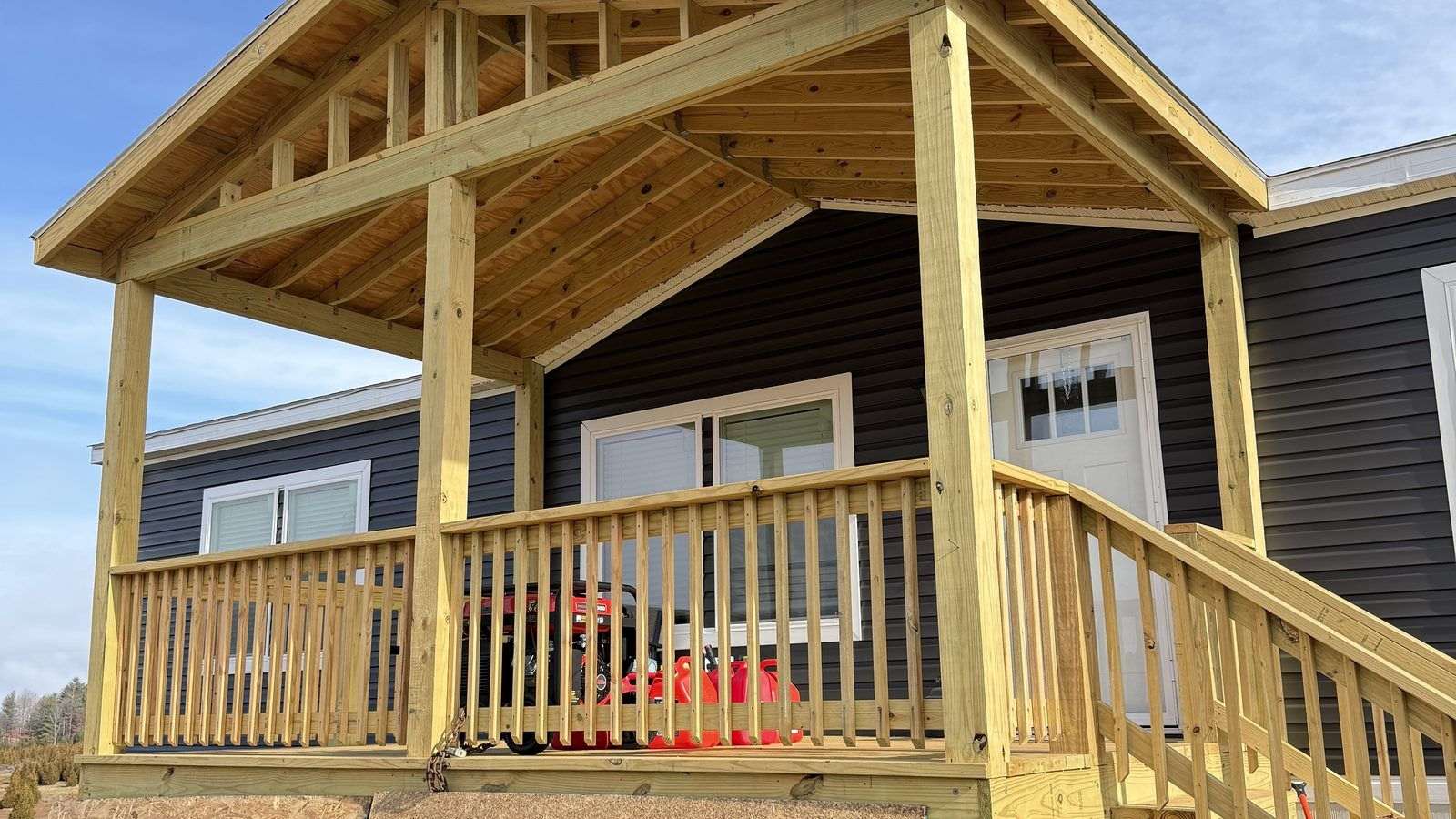 Same home before — no gutters, raw roof edge
